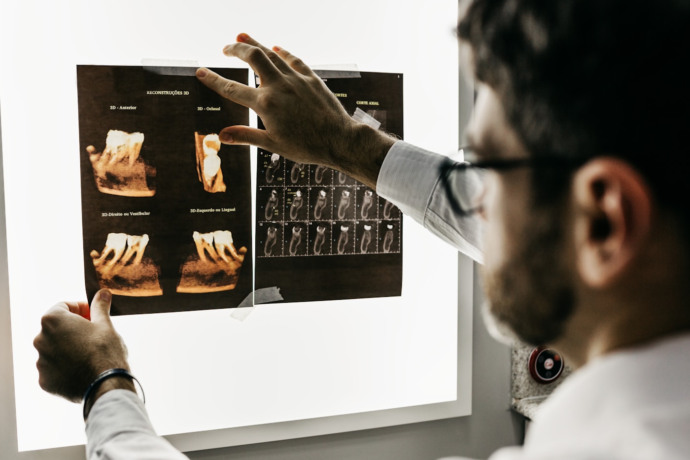 Dentist reviewing detailed dental images